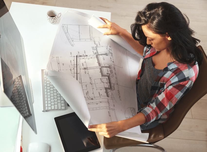 woman planning her custom home, wondering how long it will take to build it